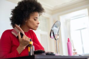 Mix-race woman brushing hair